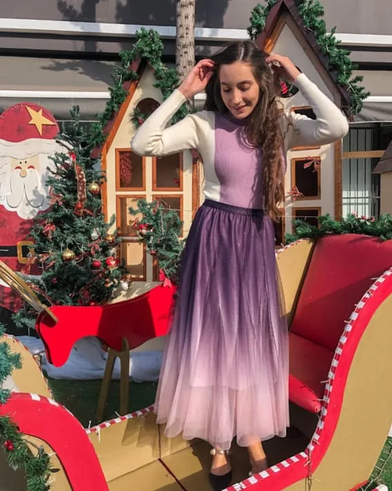 Pastel tulle skirt and cozy sweater for holiday festivities,