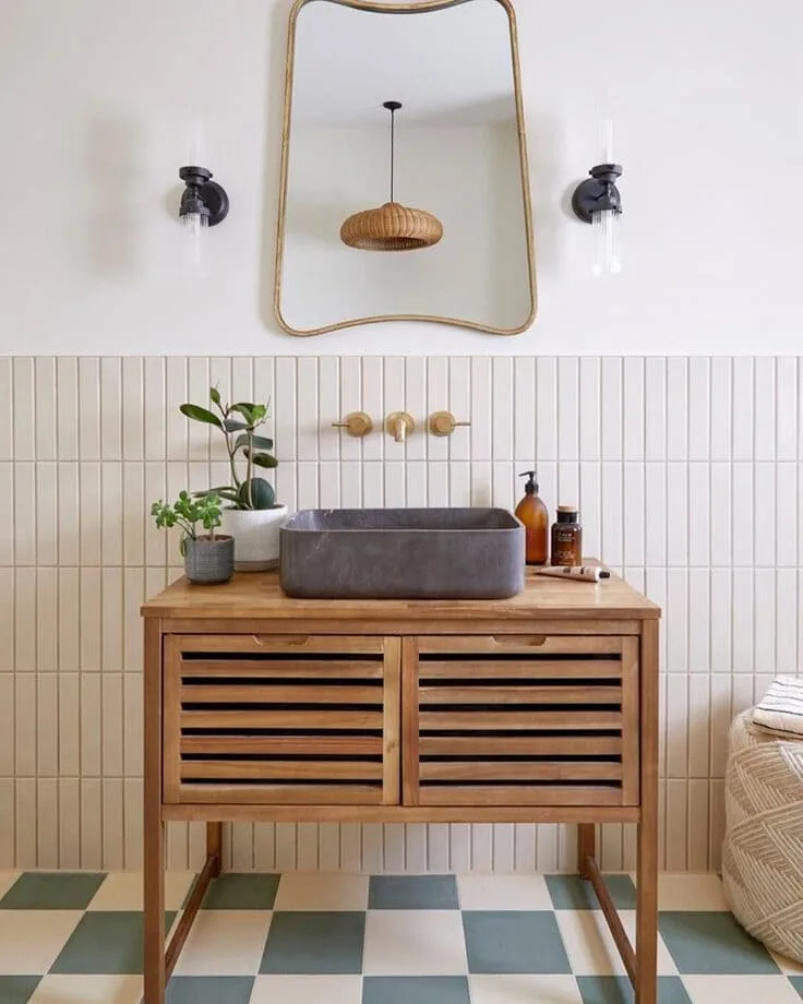 slatted wood vanity with vessel sink and checkered floor