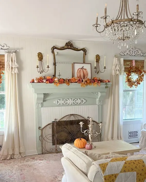 Fall mantel decor features pumpkins, garland, and vintage touches for an eye-catching autumn display.
