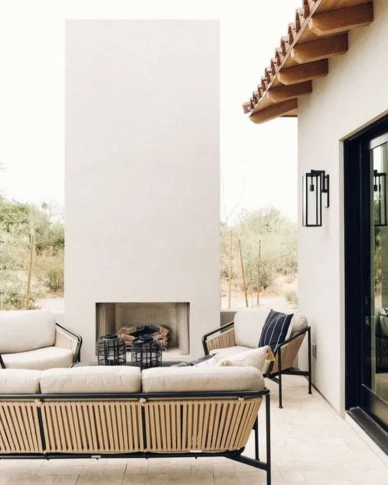 A sleek outdoor seating area with a modern fireplaces with sleek, modern lines.